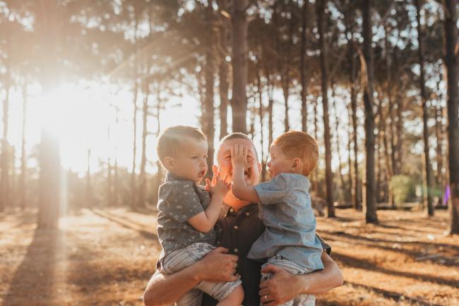 Father holding two boys during Perth family photography session at The Pines Perth with Alana Prosper Photography