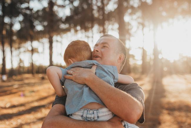father and son hugging during Perth family photography session at The Pines Perth with Alana Prosper Photography