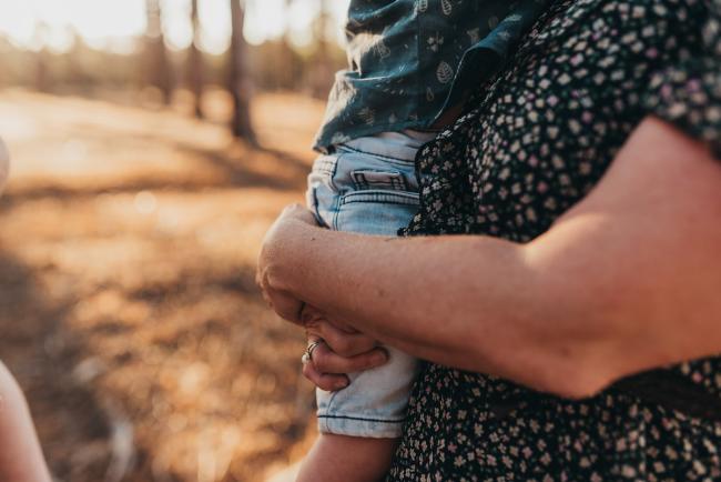 mothers hands holding son during Perth family photography session at The Pines Perth with Alana Prosper Photography