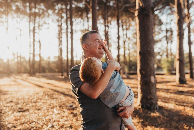 father holding son during Perth family photography session at The Pines Perth with Alana Prosper Photography