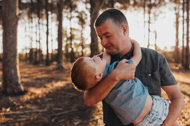 father holding son during Perth family photography session at The Pines Perth with Alana Prosper Photography