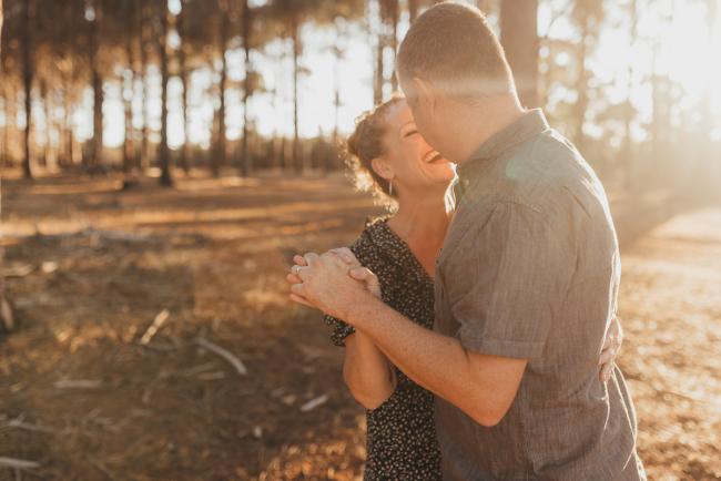 couple dancing during golden hour during Perth family photography session at The Pines Perth with Alana Prosper Photography