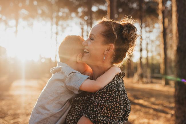 mother holding son during Perth family photography session at The Pines Perth with Alana Prosper Photography