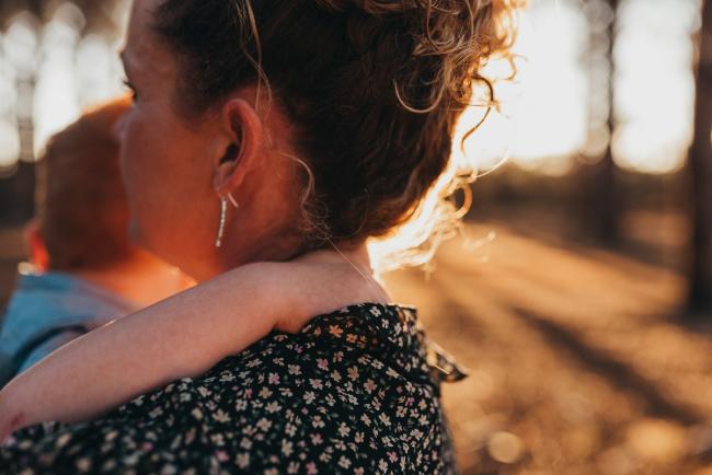 little boys hands around mothers neck during Perth family photography session at The Pines Perth with Alana Prosper Photography