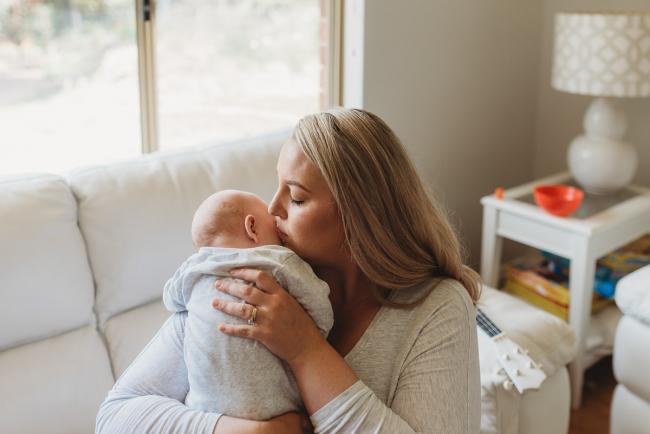 Perth-Newborn-Photographer-Alana-Prosper-Photography-31-of-31 mother kissing baby with Perth lifestyle newborn photographer Alana Prosper Photography
