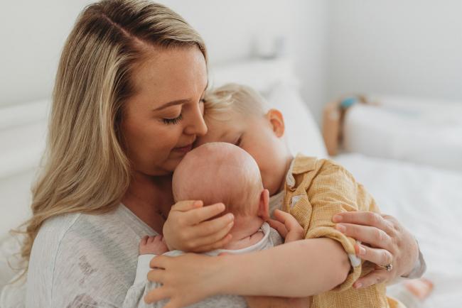 Perth-Newborn-Photographer-Alana-Prosper-Photography-7-of-31 mother hugging baby and son with Perth lifestyle newborn photographer Alana Prosper Photography