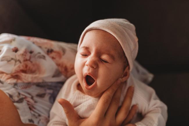 Newborn baby yawning with Perth newborn lifestyle photographer