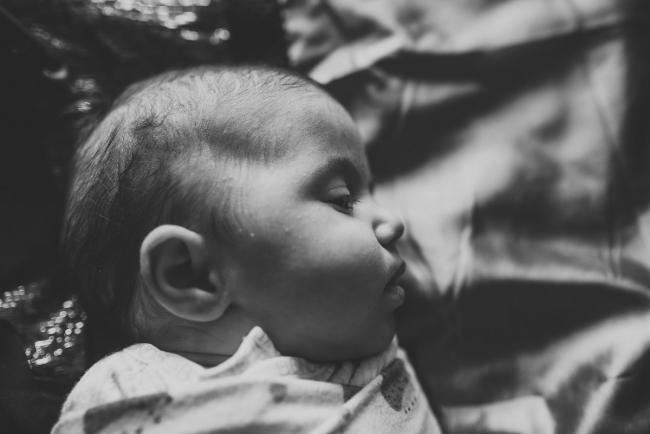 black and white image of side of baby with Perth newborn lifestyle photographer