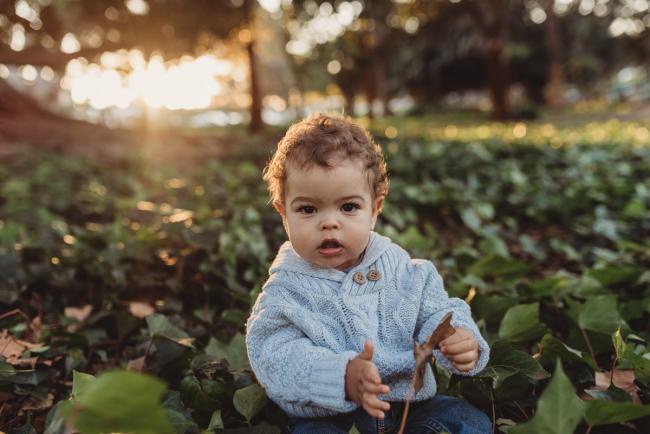 little boy in grass with Perth family photographer Alana Prosper Photography at Hyde Park