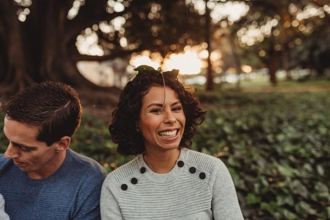 mother smiling with leaf on her head with Perth family photographer Alana Prosper Photography at Hyde Park