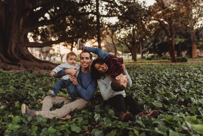 mother with son upside down and father holding other son with Perth family photographer Alana Prosper Photography at Hyde Park