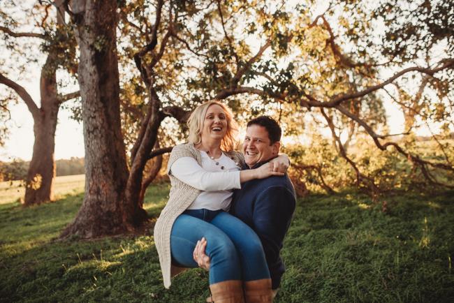 husband lifting wife with Perth family photographer Alana Prosper Photography at Perry's Paddock